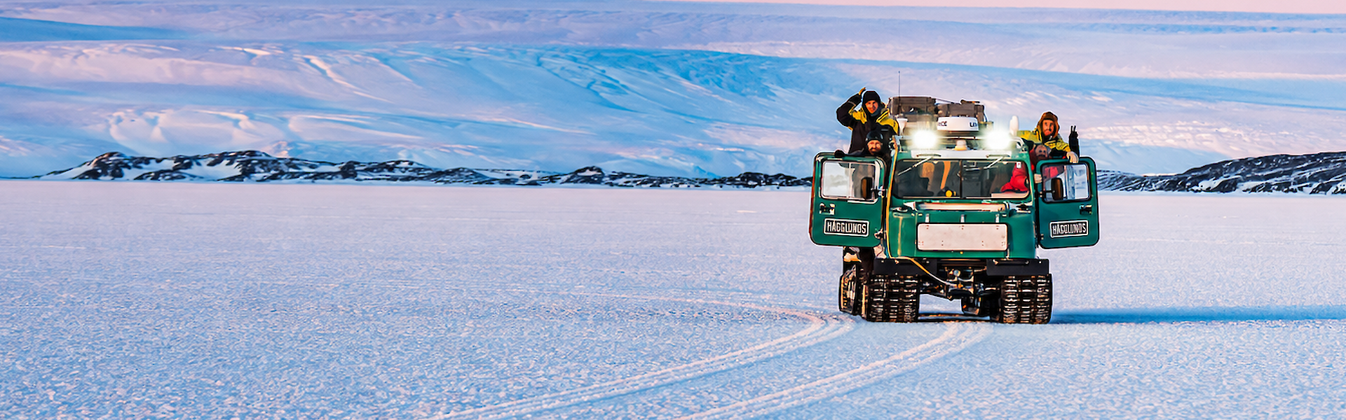 Expeditioners use a Hagglunds to travel across the ice