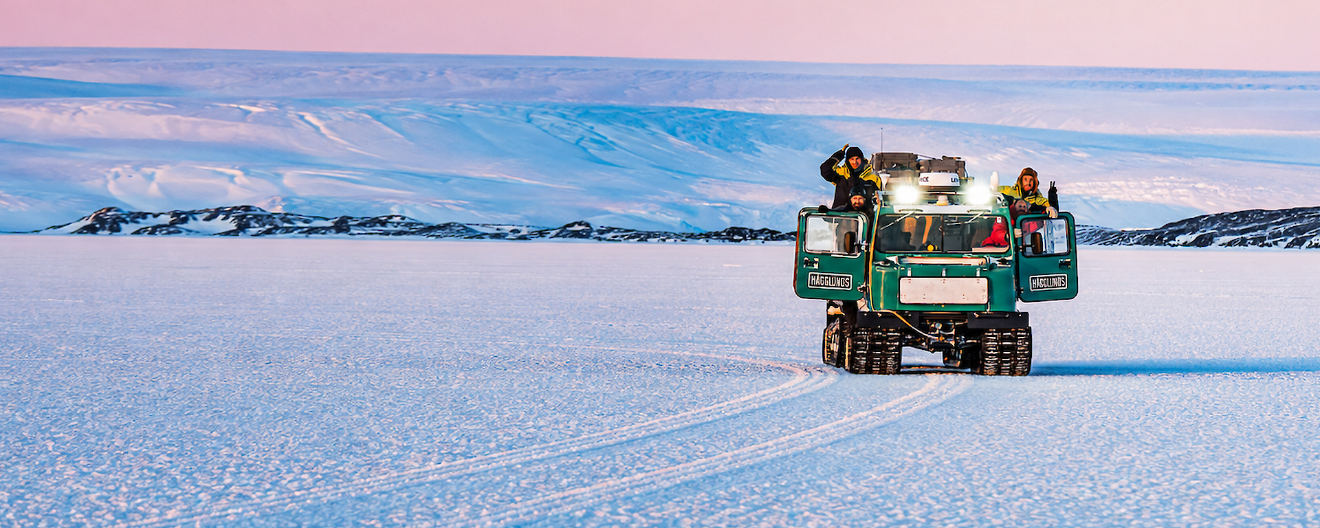 Expeditioners use a Hagglunds to travel across the ice