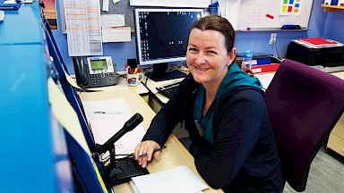 Communications officer operating communications equipment