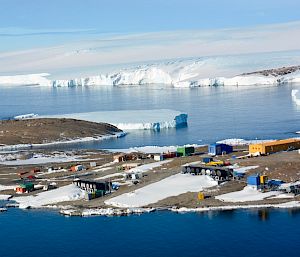Aerial view of Mawson station and East Bay with ice sheet on clear day.
