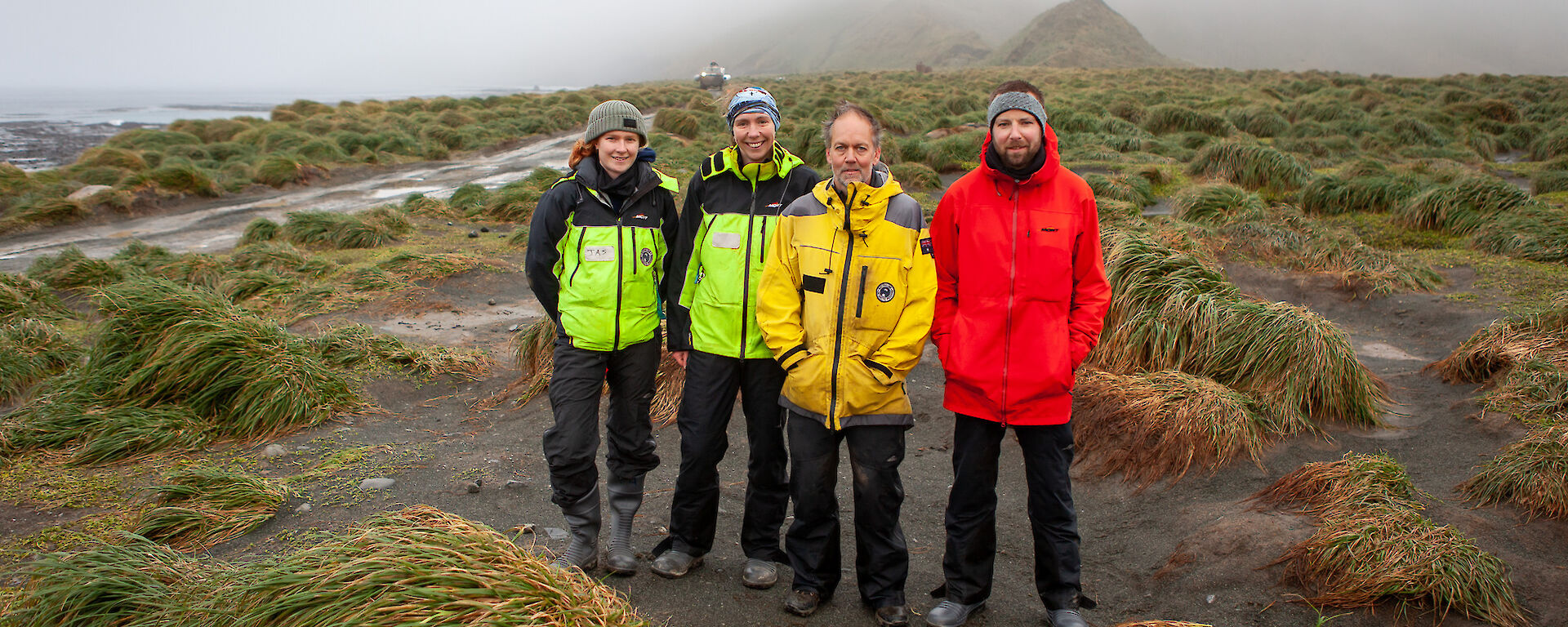 Dr Aleks Terauds (third from left), Australian Antarctic Division/Research Scientist with Dr Kris Carlyon (far right), Department of Natural Resources and Environment/Wildlife Biologist on Macquarie Island.