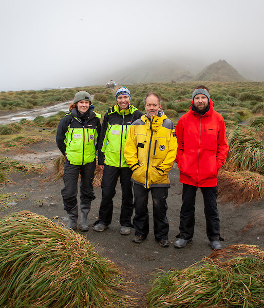 Dr Aleks Terauds (third from left), Australian Antarctic Division/Research Scientist with Dr Kris Carlyon (far right), Department of Natural Resources and Environment/Wildlife Biologist on Macquarie Island.