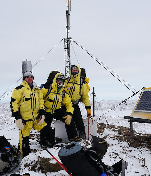 Group of expeditioners standing near VHF repeater