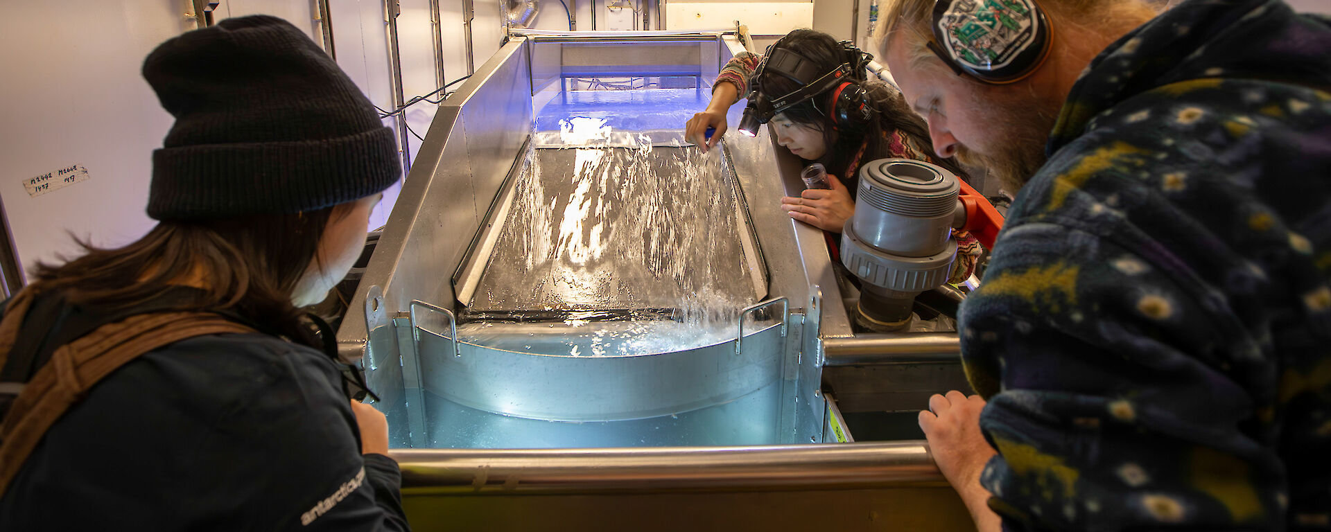 Scientists work in the wet well on RSV Nuyina capturing krill